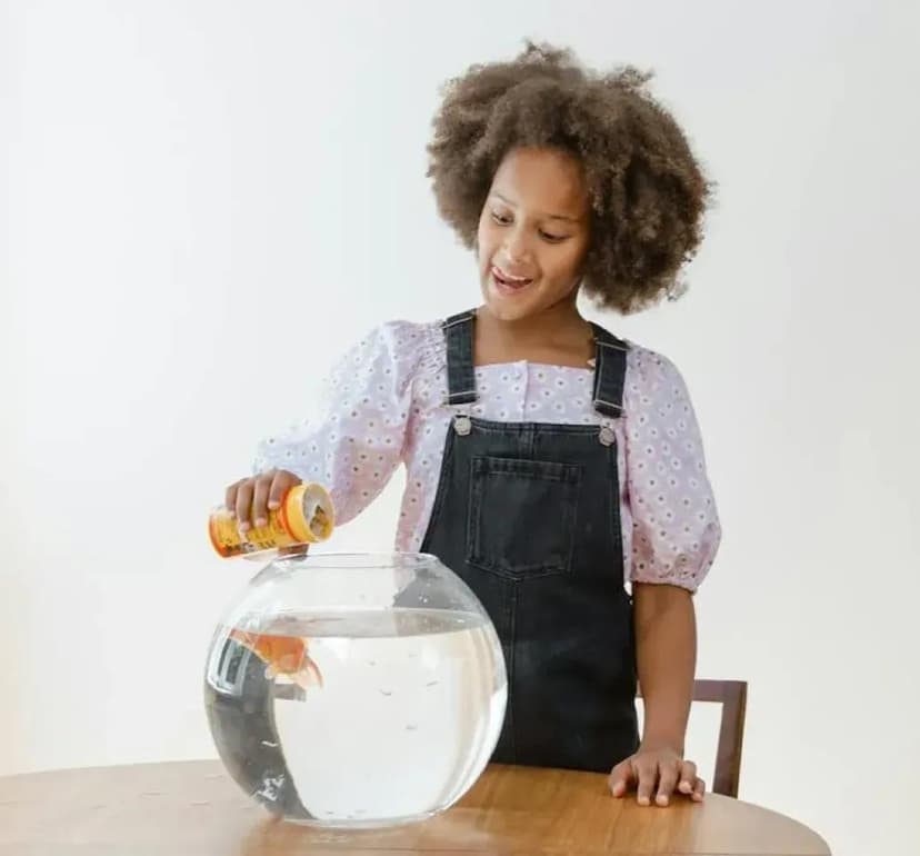 Pet care imagery featuring Omega One Goldfish Pellets