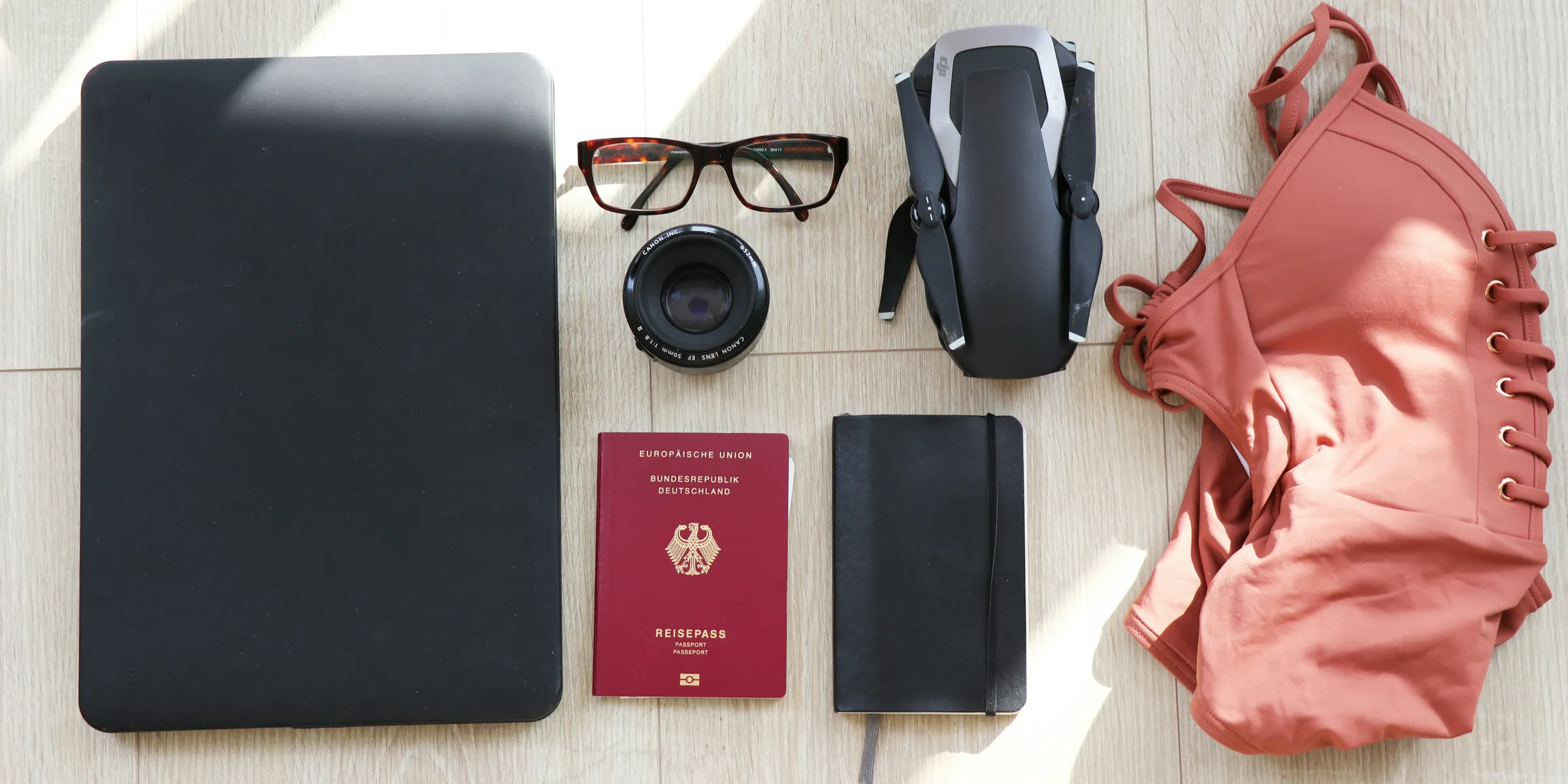aerial photography of couple standing between body of water